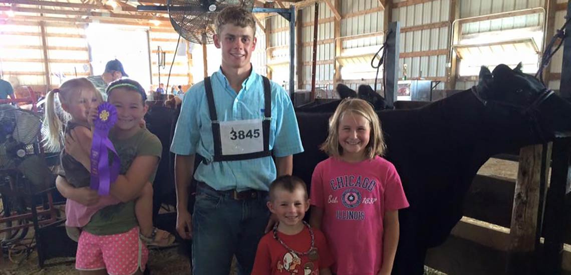 Chase with his biggest fans at the Hutchinson County Achievement Days. He also took home Grand Champion and Reserve Champion Breeding Heifer.